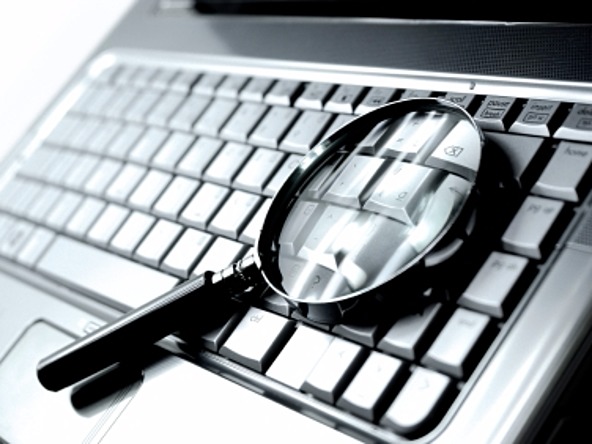 magnifying glass on laptop
